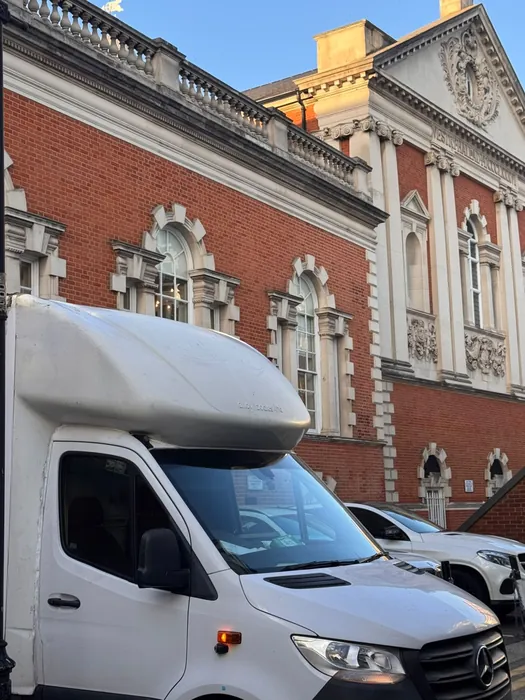 On location with our tail-lift Luton van on a London street — part of the daily work moving homes and businesses across West London and the wider UK.